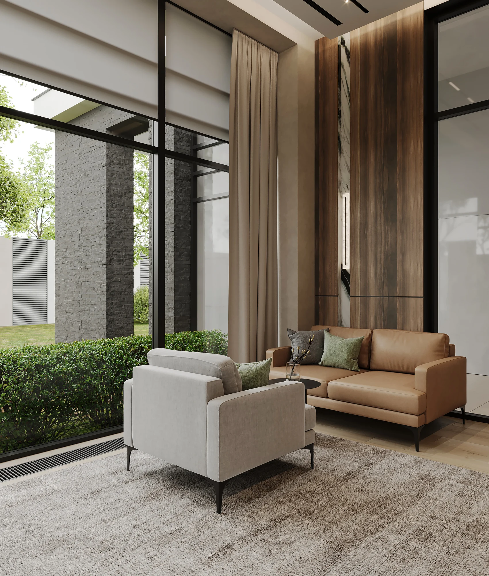 Armchairs and a sofa beside full-height windows in the home office