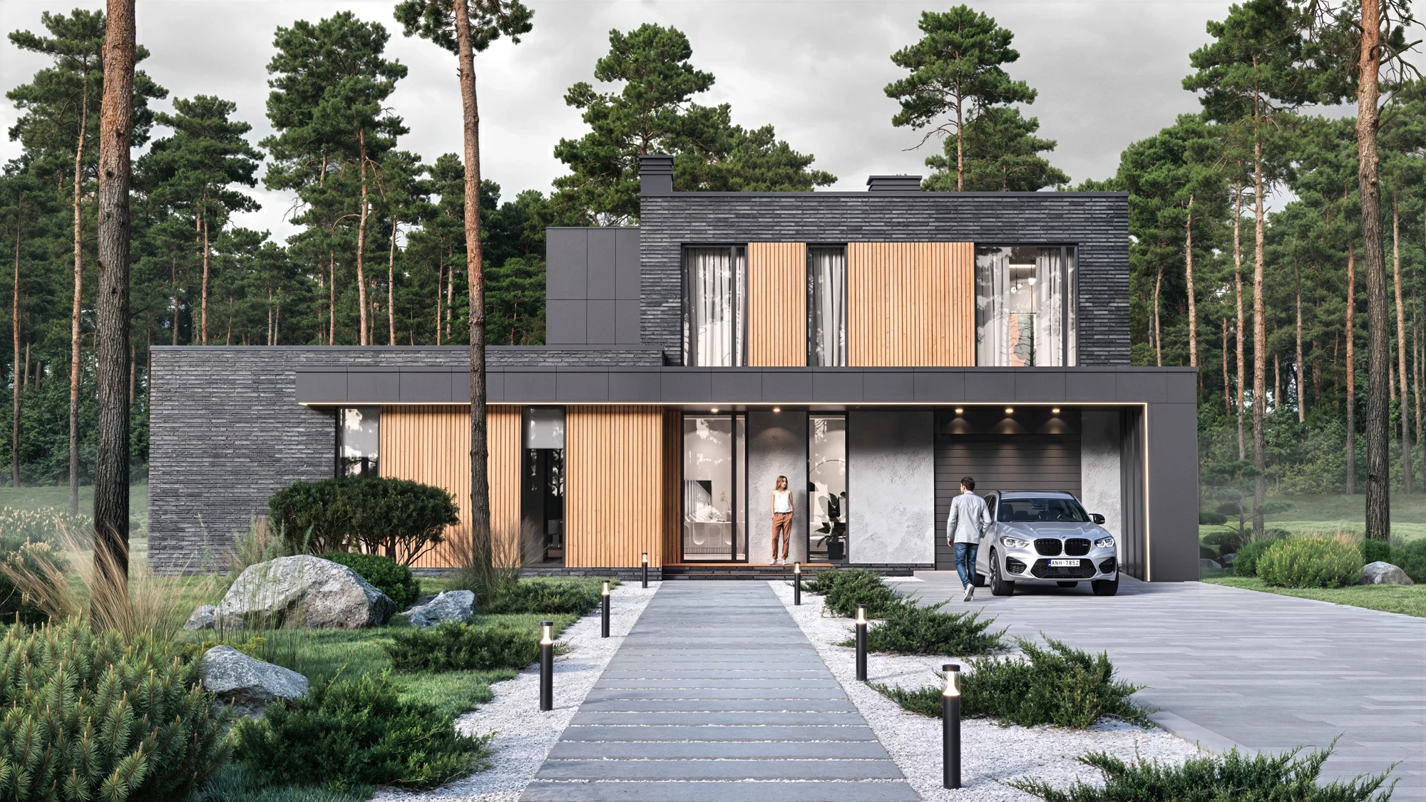 Modern villa with dark brick and timber cladding, an entrance path and a driveway among pine trees